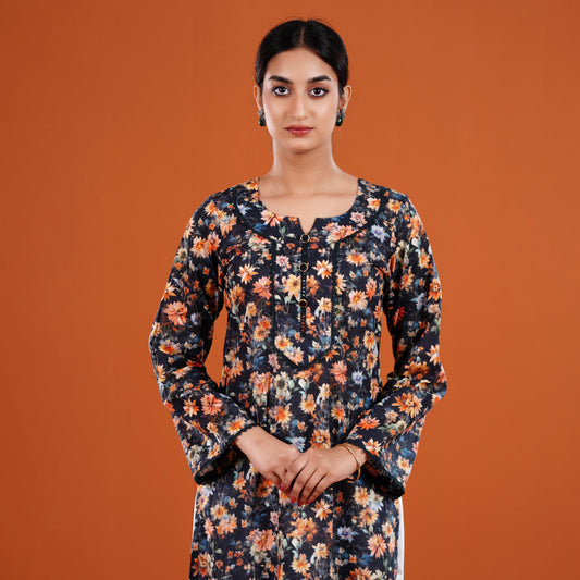 Woman wearing a floral dress against an orange background