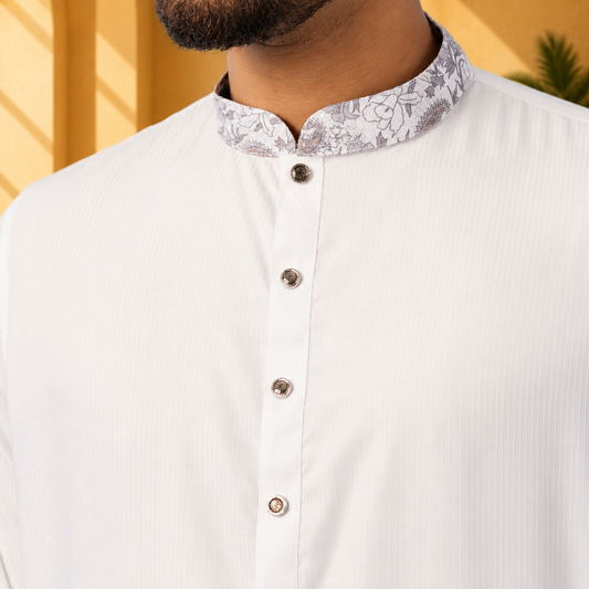 yamaan royal panjabi with floral collar and buttons on a blurred background