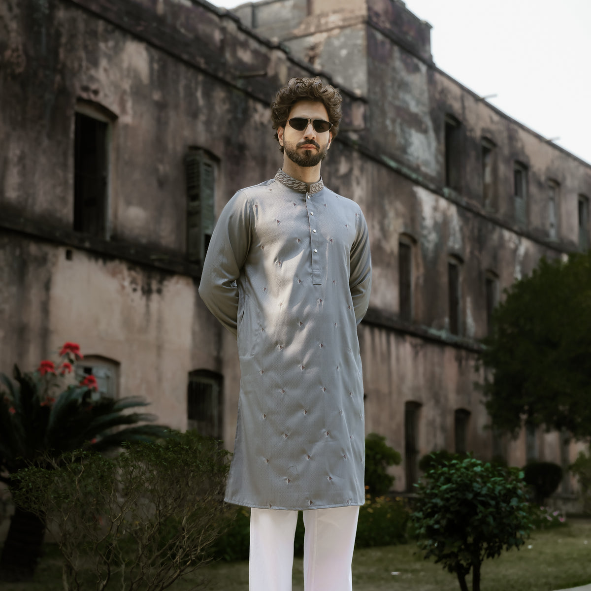 Men wearing a YAMAAN Imperial Panjabi on a traditional place 