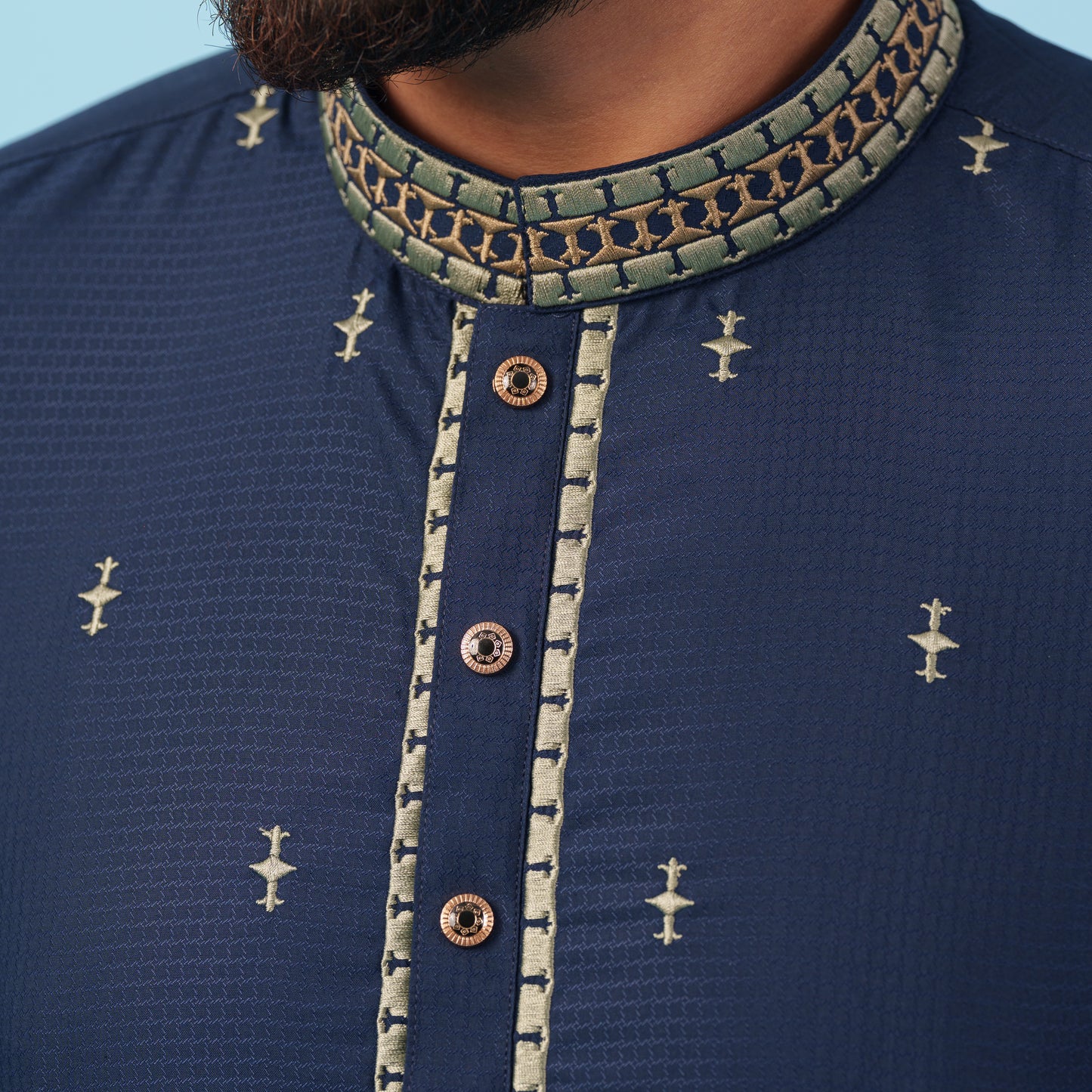 YAMAAN Navy blue kurta with golden embroidery on a light blue background