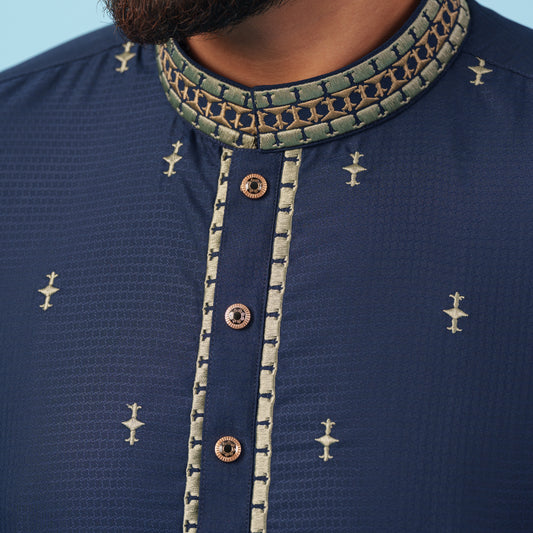 YAMAAN Navy blue kurta with golden embroidery on a light blue background