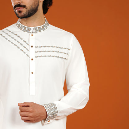 White embroidered panjabi with silver details on a brown background