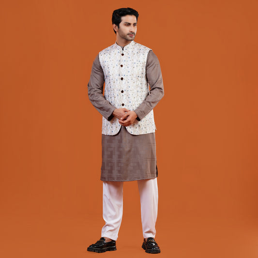 Man wearing a traditional YAMAAN PANJABI with a YAMAAN WAISTCOAT on an orange background