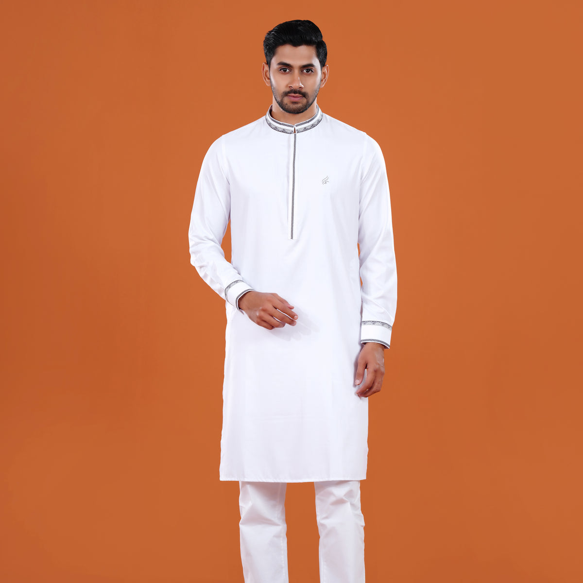 Man wearing a white panjabi with a brown background