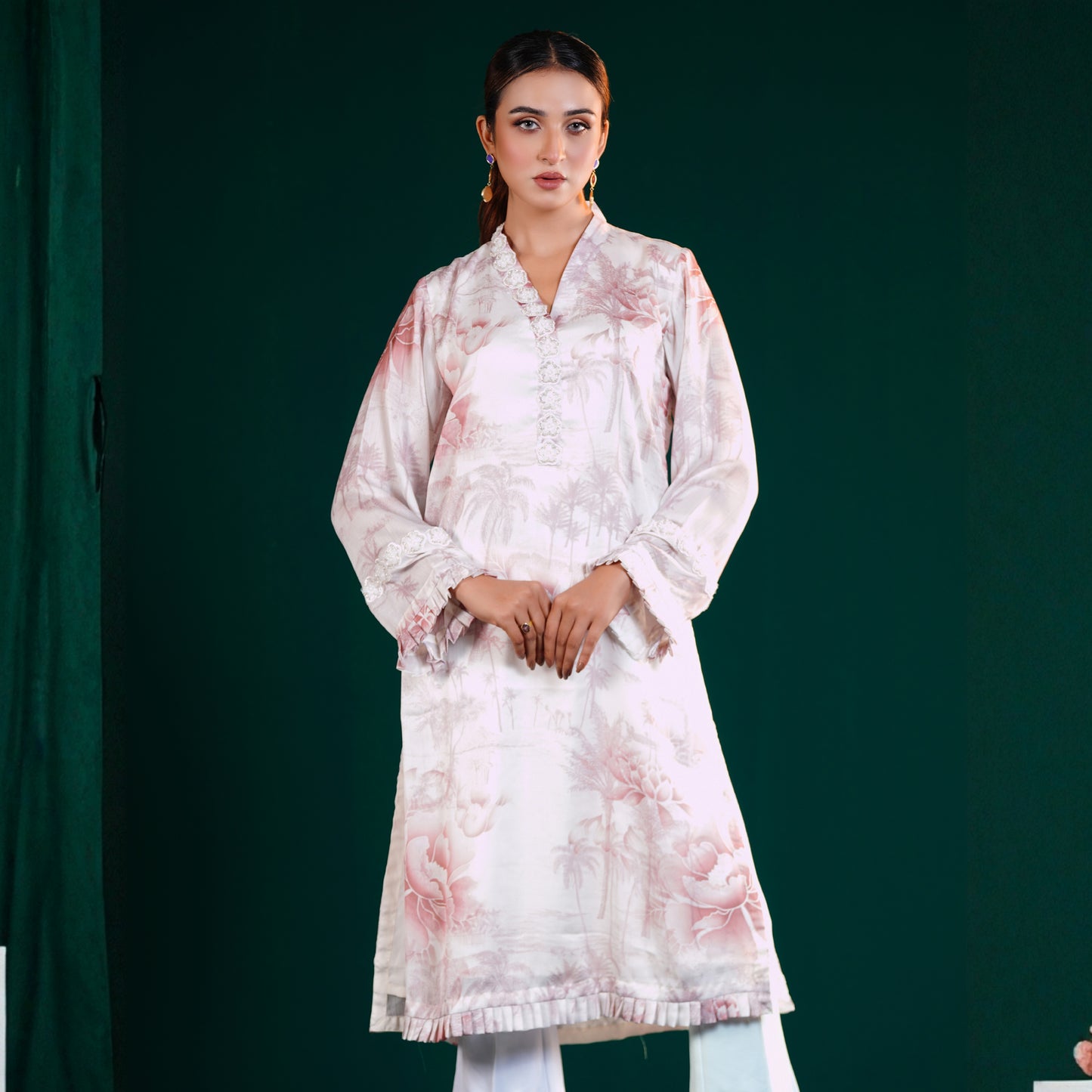 Woman wearing a YAMAAN Off White kurti Set light pink floral kurta against a dark green background