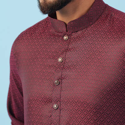 Maroon patterned yamaan-royal-panjabi-dark-maroon panjabi with buttons on a light blue background