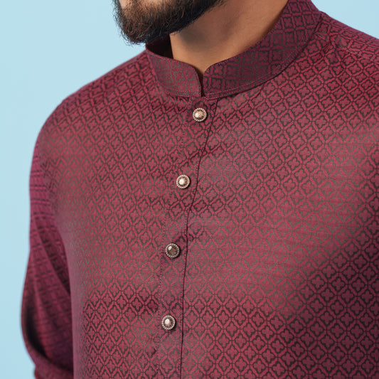 Maroon patterned yamaan-royal-panjabi-dark-maroon panjabi with buttons on a light blue background