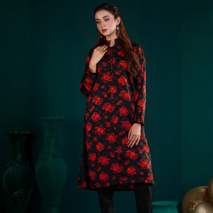 Woman wearing a YAMAAN Royal Red Kurti with red floral pattern against a dark green background