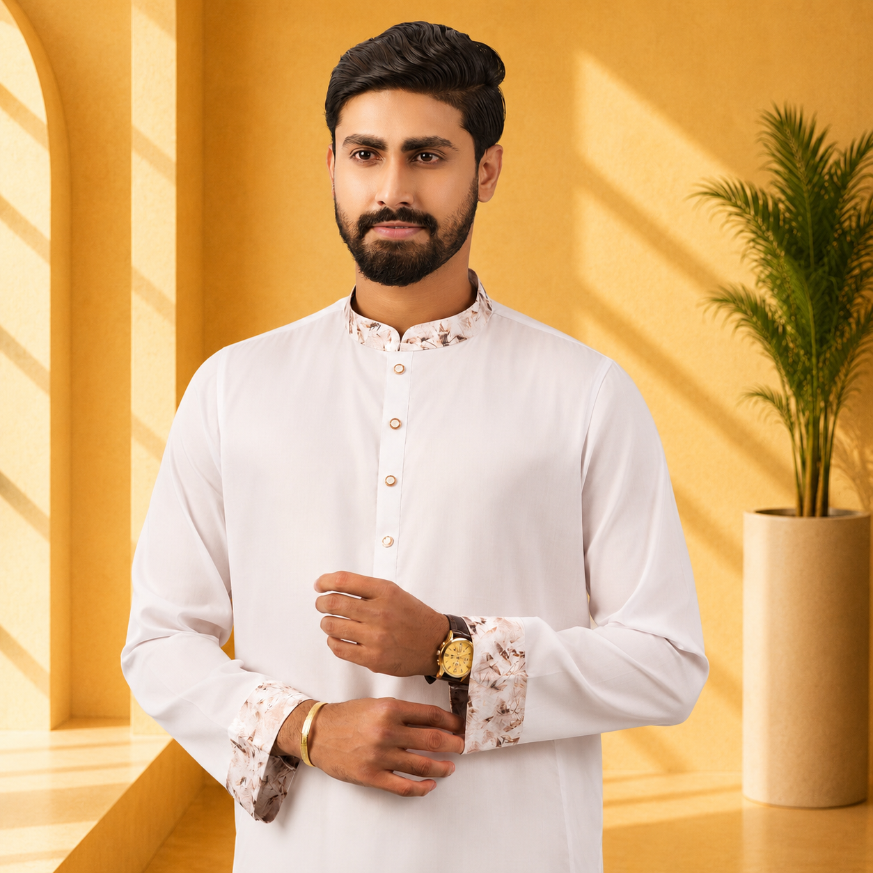 Man wearing a yamaan royal fine cotton Panjabi a traditional outfit with a yellow background