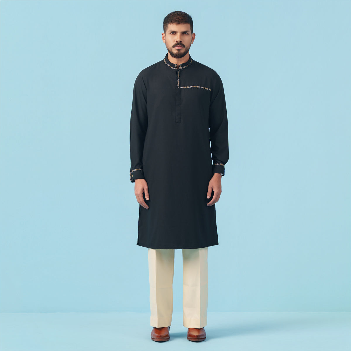 A stylish man wearing a yamaan signature panjabi.  