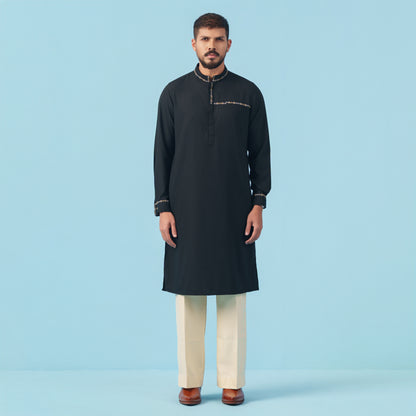 A stylish man wearing a yamaan signature panjabi.  