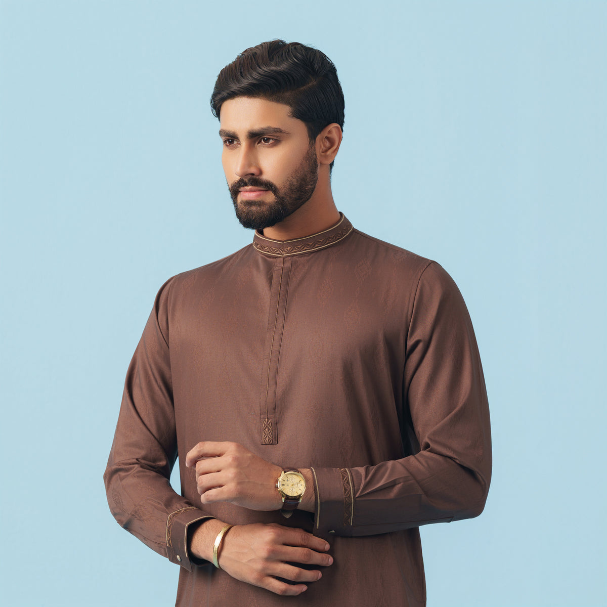 Man wearing a dark brown yamaan traditonal panjabi